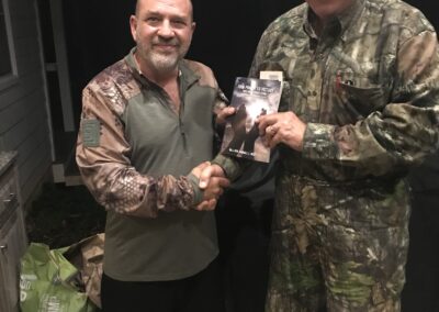 General West presenting a signed copy of his book, Desert Storm, "From Prayer to Victory" to TSgt Eddie Hawks. Hawks, a USAF Vet was at Khobar Towers when it was attacked.  He went on a recent hunting trip at George Thorton's Hunting Camp in South Carolina.